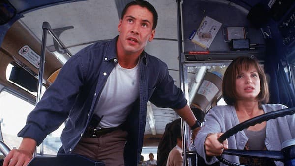 Keanu Reeves and Sandra Bullock on the runaway train from the blockbuster movie Speed.