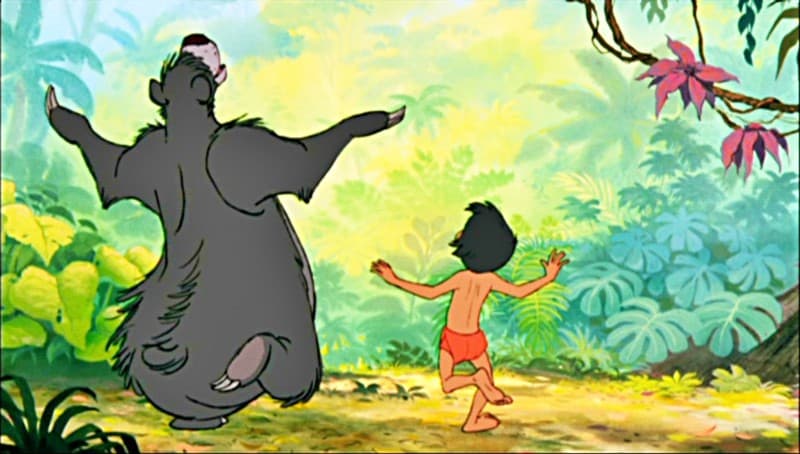 Baloo and Mowgli dancing in Disney's Jungle Book during the musical number the Bear Necessities.